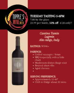 Promotional image for Tipple’s Wine of the Week featuring a bottle of Cantina Tramin Lagrein from Alto Adige, Italy. The layout uses a red background with a black banner across the top displaying the Tipple’s Wine of the Week logo. Text announces a Tuesday tasting from 5 to 8 PM with pricing of 7 dollars per glass and 23.99 per bottle, with a 15 percent discount available on April 28 only. The wine is noted with a rating of WS 90 plus. Pairing suggestions listed include grilled sausages or brats, barbecue with char, mushroom dishes, braised short ribs, and aged cheeses. Serving guidance recommends a temperature of approximately 55 to 60 degrees with about 30 minutes of chilling in the refrigerator. The design is clean and informative, highlighting both the featured wine and the in-store tasting event.